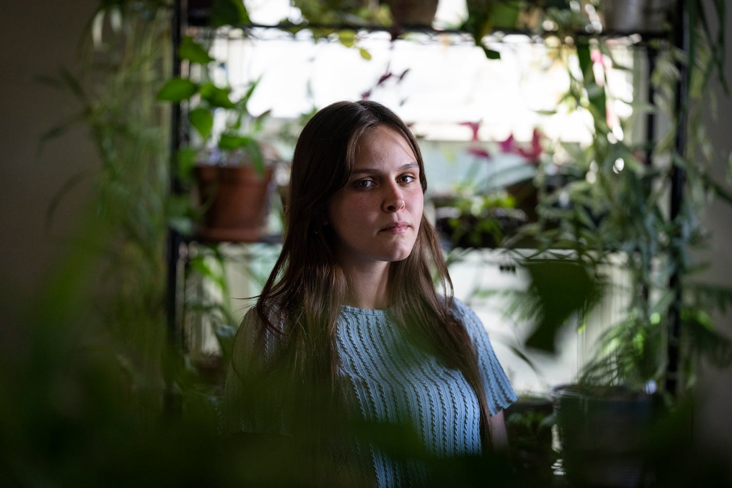 Annalie Peterson poses for a portrait inside her home in Baraboo, Wis. on Thursday, Sept. 14, 2023. Peterson was 17 when her volleyball trainer statutorily raped her in Minnesota. He had done the same thing at a previous job in Wisconsin, where he was criminally charged, but that didn't show up on his background check.