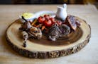 The game platter including quail, venison and duck is a signature meal at New Scenic Café.