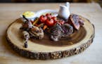 The game platter including quail, venison and duck is a signature meal at New Scenic Café.