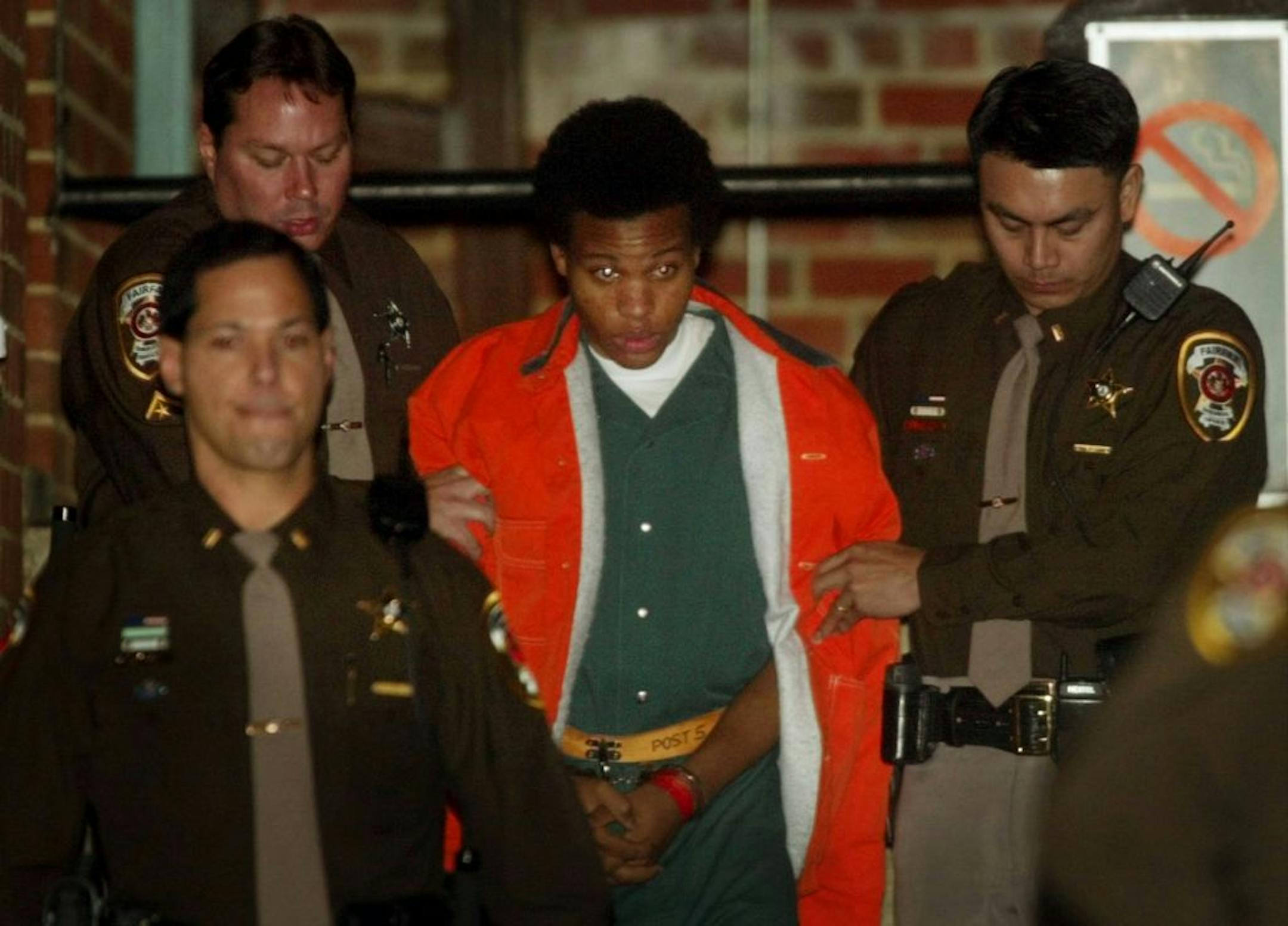 Lee Boyd Malvo in January 2003 as he was escorted from court after a preliminary hearing in Fairfax, Va. Malvo is now 27 and expresses deep regret about his role in the murders.