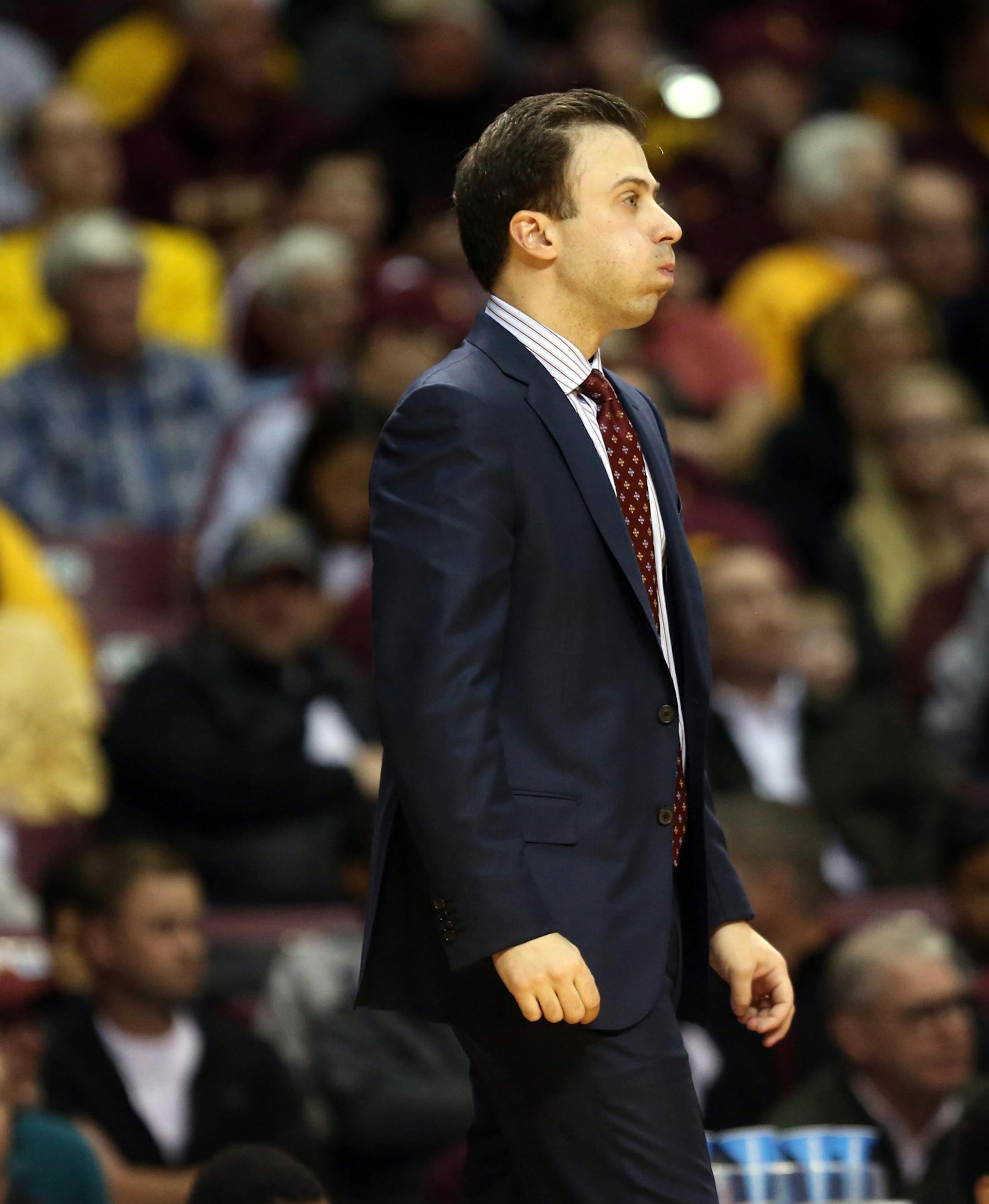 Gopher head coach Richard Pitino blew out some after pulling ahead of High Point during the last seconds in the second half. ] (KYNDELL HARKNESS/STAR TRIBUNE) kyndell.harkness@startribune.com First round of the National Invitational Tournament at Williams Arena in Minneapolis Min, Tuesday March 18, 2014. Gophers won 88-81 over High Point.