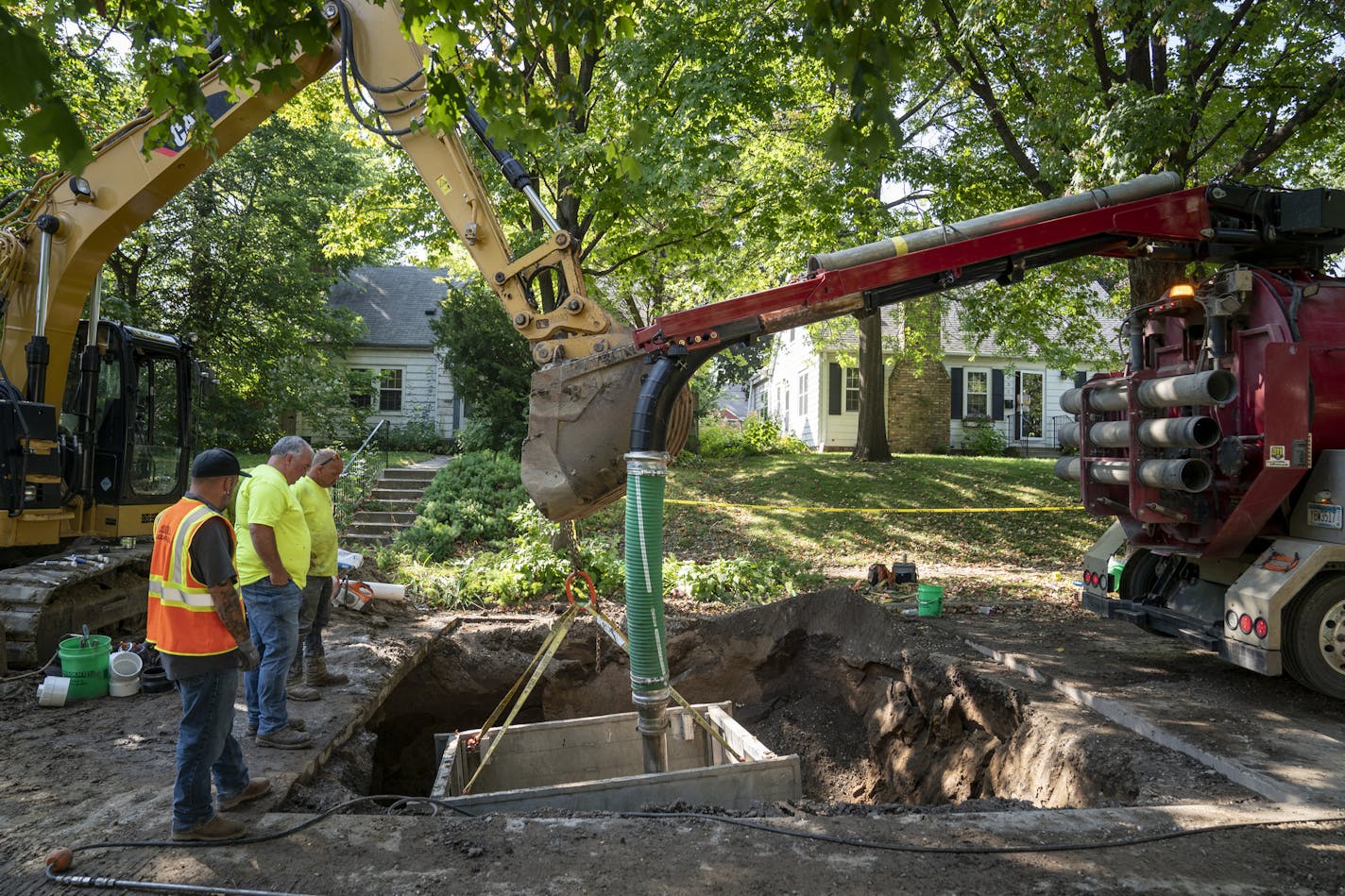 A crew worked on a sewer break by digging a big hole in the road in a neighborhood near Lake Nokomis in Minneapolis, Minn., on Tuesday, September 17, 2019. According to neighbor Joan Soholt, this is the 10th project like this on the block since 2014. This is likely due to the high water table also impacting other homes in the area.