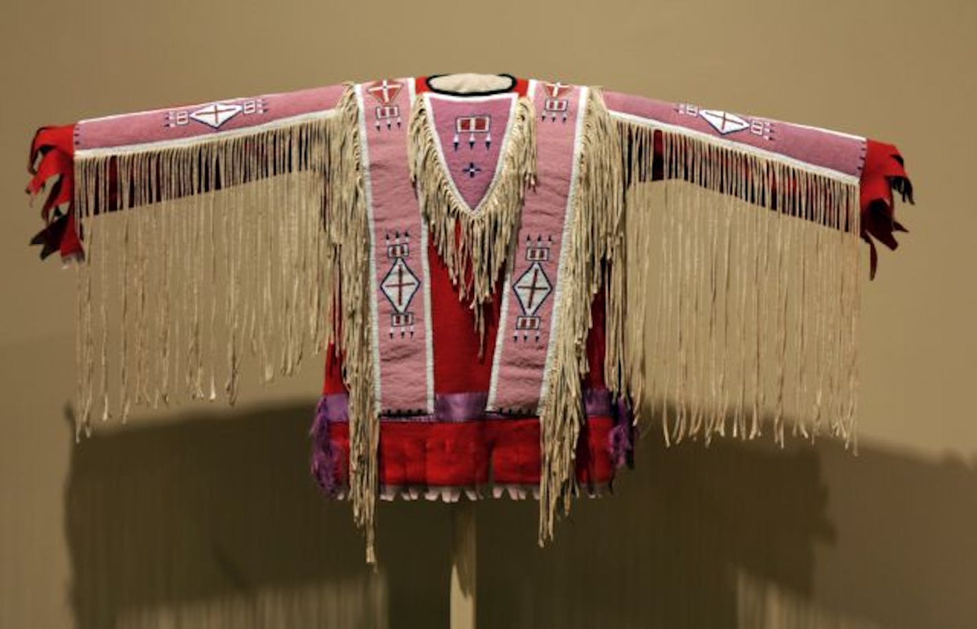 detail of items from the MIA exhibit " Art of the White Clay people", - beaded shirt - curated by Joe Horse Capture.