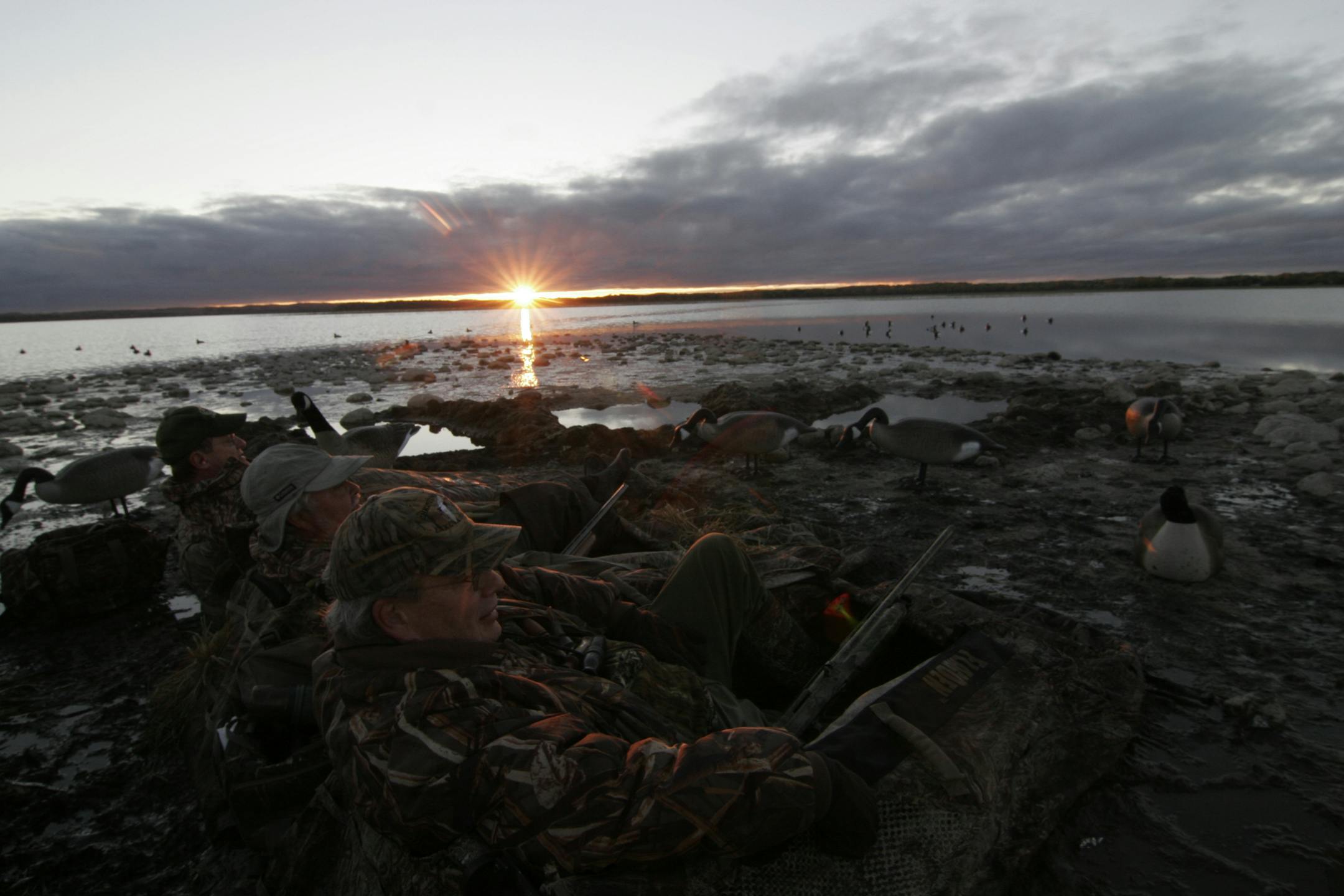 Friends Tom Warnke of Blaine, Brad Gruss of Ashby and Doug Huberty of Elk River hunted Satruday morning on Lake Christinia on Minnesota's duck opener.