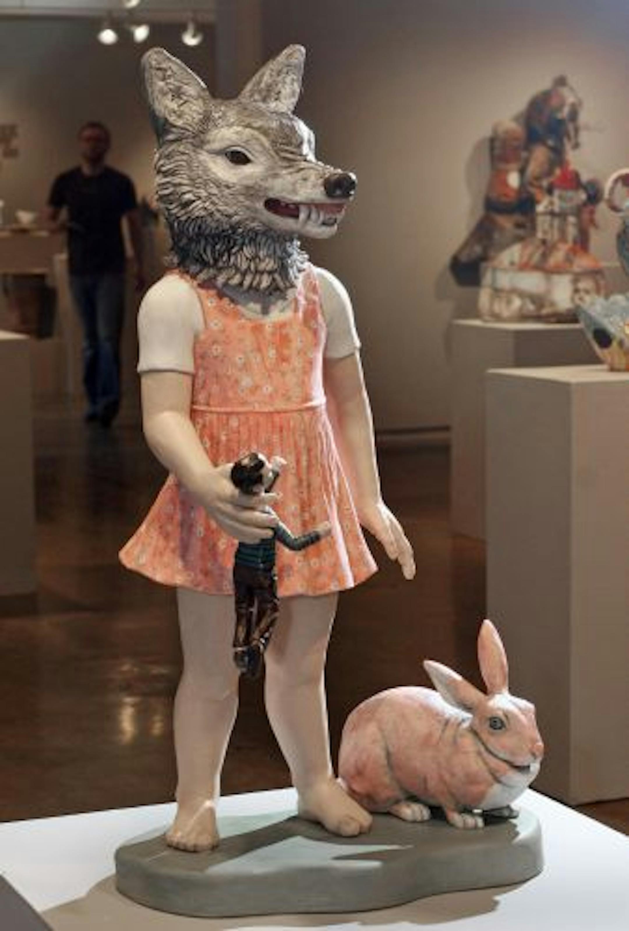 Cynthia Consentino's ceramic "Wolf Girl" crushes a struggling boy-toy in a tableau of innocence run amok.