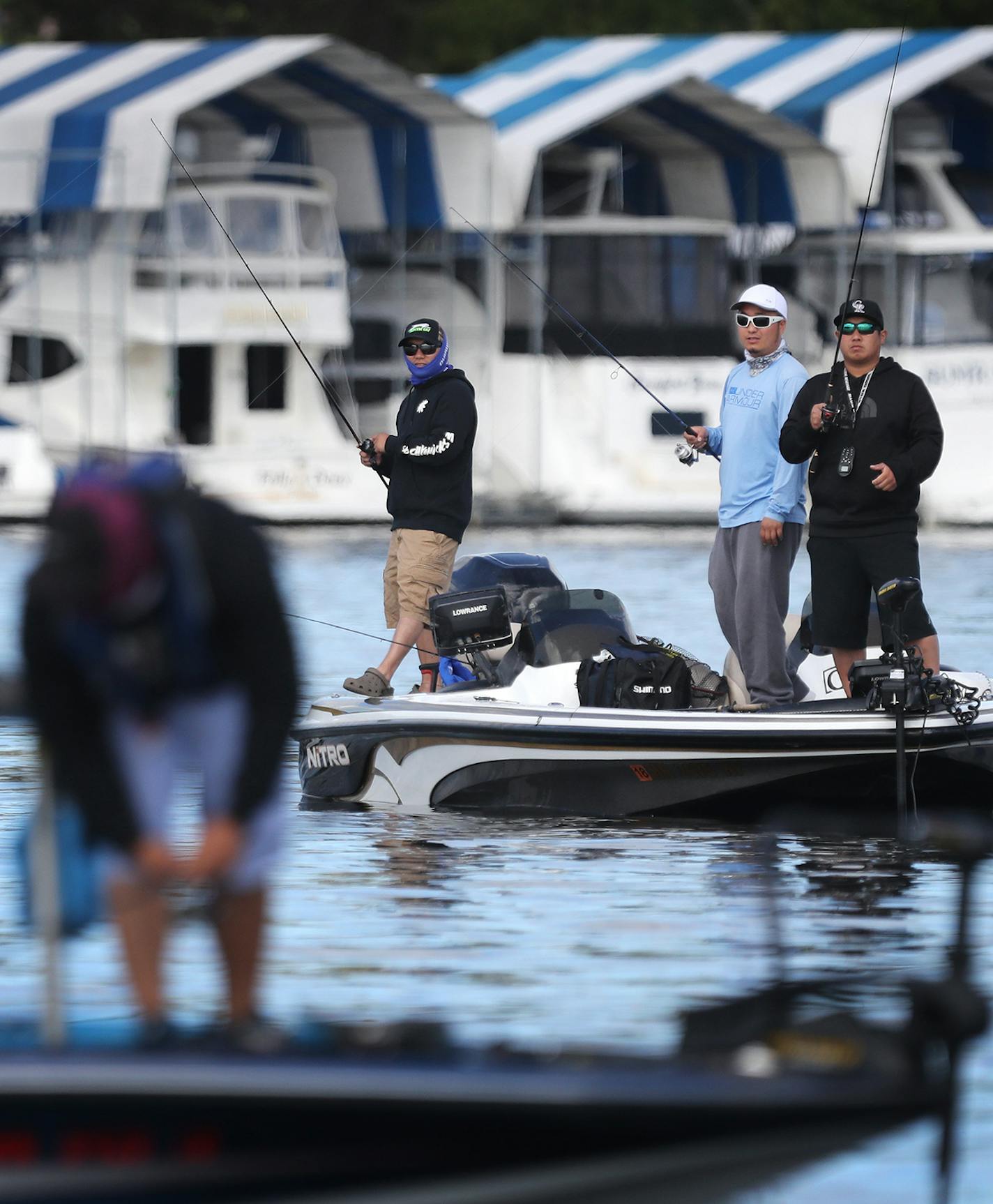 Fishermen compete in the Hmong Bass Fishing Tournament on the St. Croix River. ] (Leila Navidi/Star Tribune) leila.navidi@startribune.com BACKGROUND INFORMATION: The 10th annual Hmong Bass Fishing Tournament on the St. Croix River on Friday, July 1, 2016.