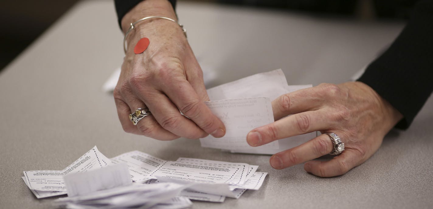 Counting the ballots for the Burnsville precinct 9 Republican caucus Tuesday night. Sen. Marco Rubio won with 40 votes, followed by Sen. Ted Cruz with 19, Donald Trump 17, Ben Carson 7, and John Kasich 3. ] JEFF WHEELER &#xef; jeff.wheeler@startribune.com Eagan and Burnsville residents gathered to attend their precinct caucuses at Black Hawk Middle School Tuesday evening, March 1, 2016. ORG XMIT: MIN1603012054533201