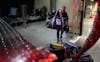 Natalie Darwitz, general manager of the PWHL's Minnesota team, loads duffel bags onto the team’s truck at Xcel Energy Center in January. With such a