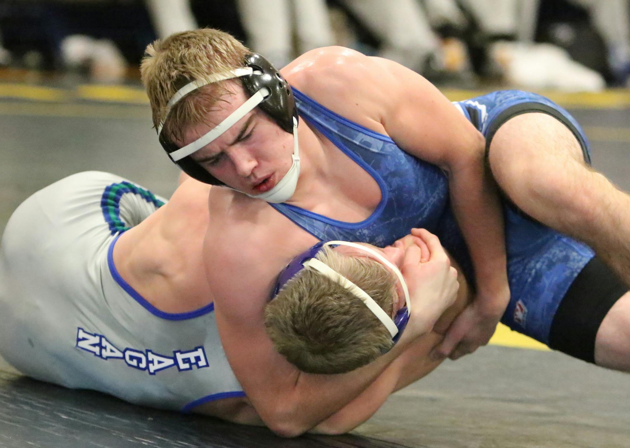 Eastview 170-pounder Alex Lindstrom gets ready to pin Roth Stricker of Eagan. Lindstrom recently broke the school record for career wins.
