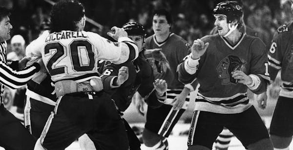 Dino Ciccarelli and Denis Savard of the Blackhawks square off in a March, 1983 game between the North Stars and Chicago. BRUCE BISPING file photo
