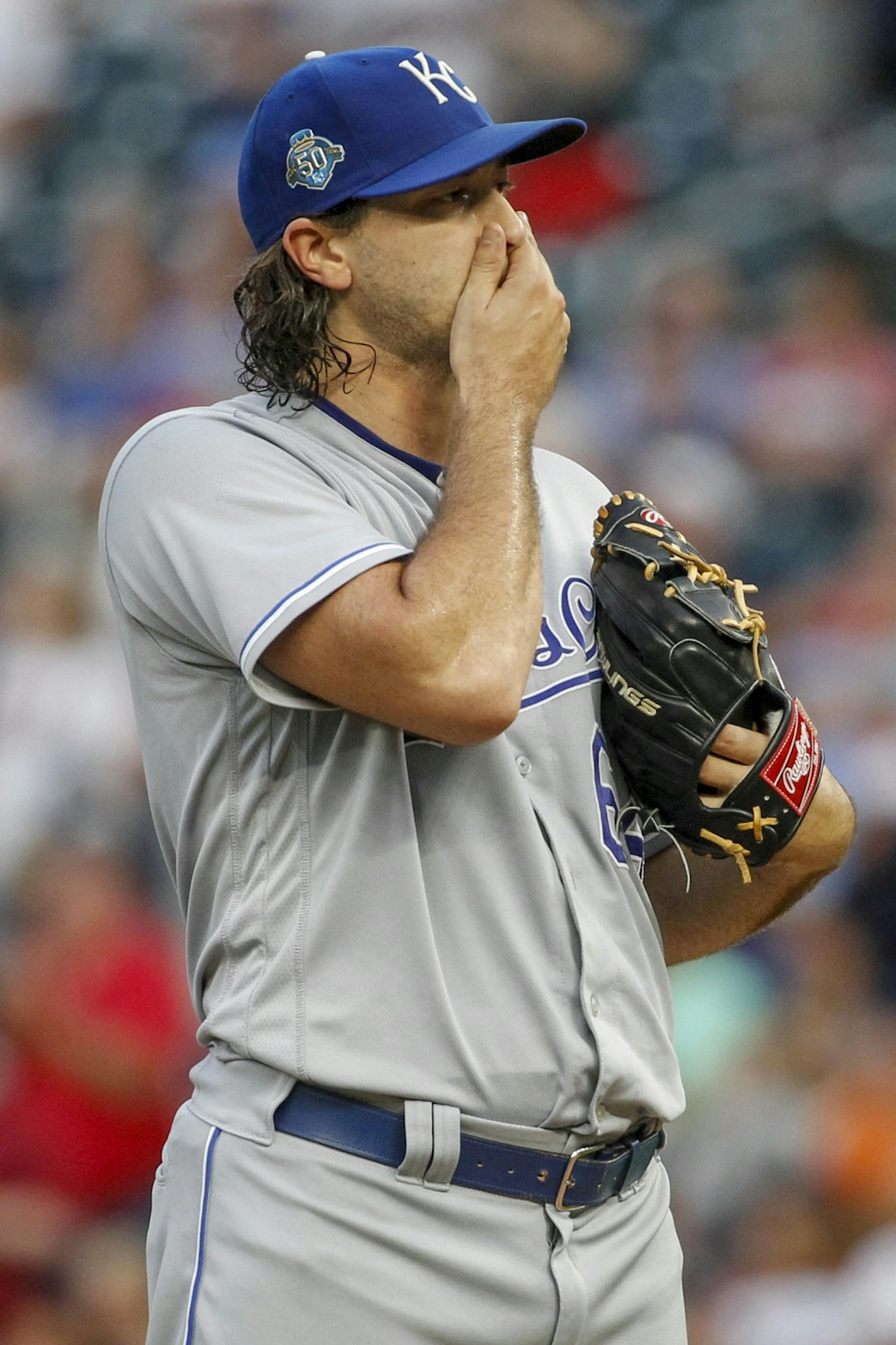 Kansas City Royals starting pitcher Burch Smith reacts after giving up a home run to Minnesota Twins' Max Kepler during the fourth inning of a baseball game Saturday, Aug. 4, 2018, in Minneapolis. The Twins won 8-2.