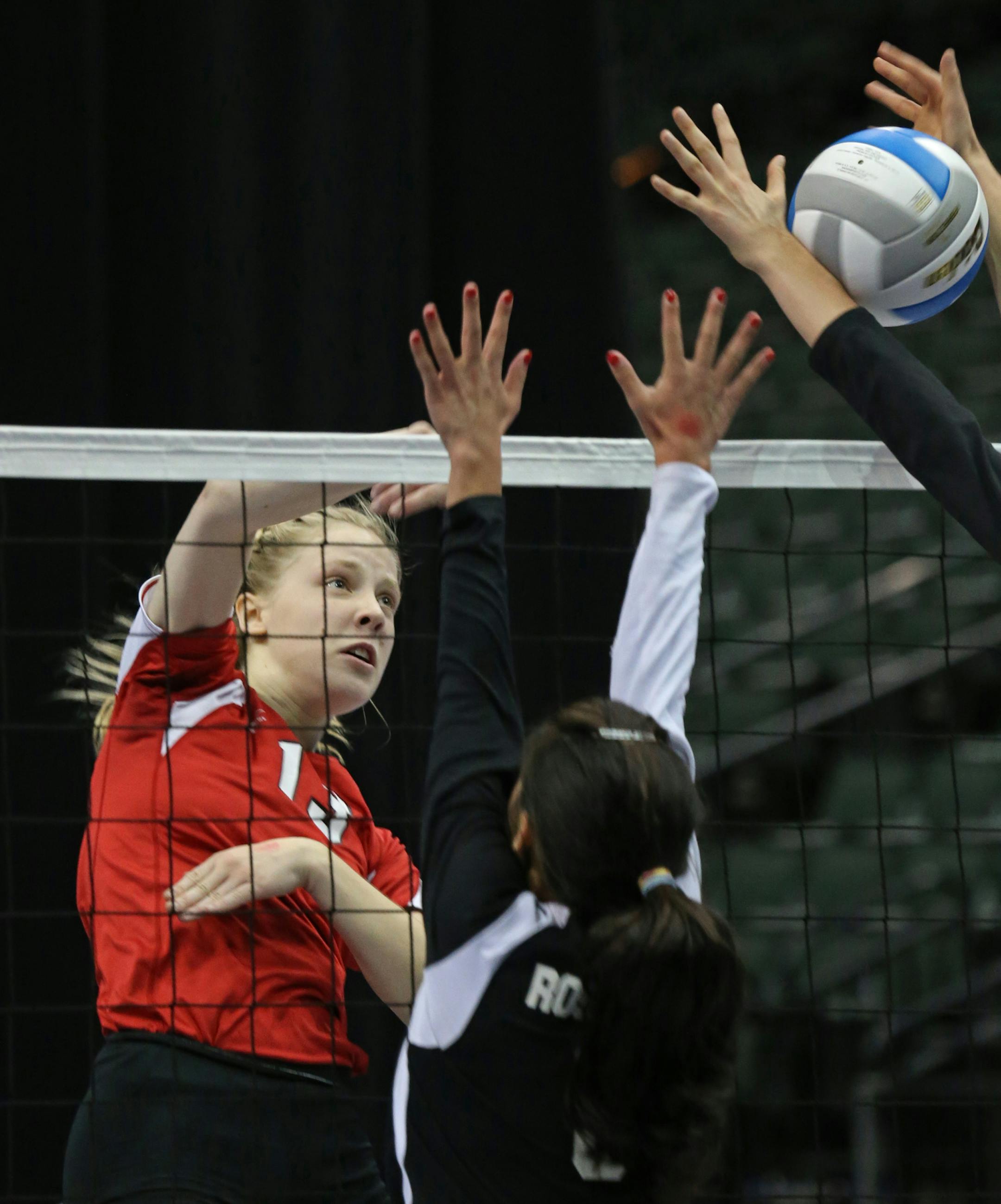 Minnesota State High School League Girls Volleyball State Tournament, 11/7/13, Xcel Energy Center. Class 3A state volleyball quarterfinals, Eden Prairie vs. Roseville. (left to right) Eden Prairie's Aulora Campbell spiked the ball past the Roseville defense.] Bruce Bisping/Star Tribune bbisping@startribune.com Aulora Campbell/roster.