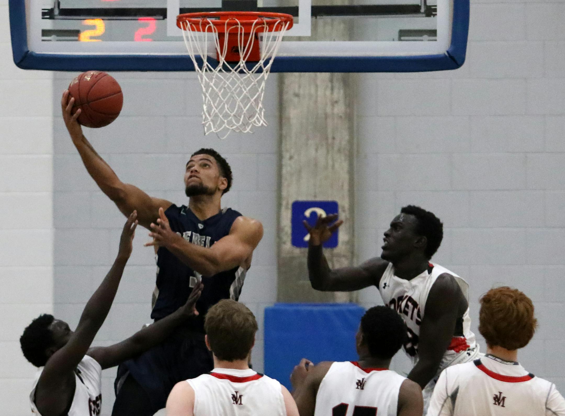 Theo John of Champlin Park goes up with the ball in a Dec. 3 game against Rochester John Marshal at Hopkins' Lindberg Center.