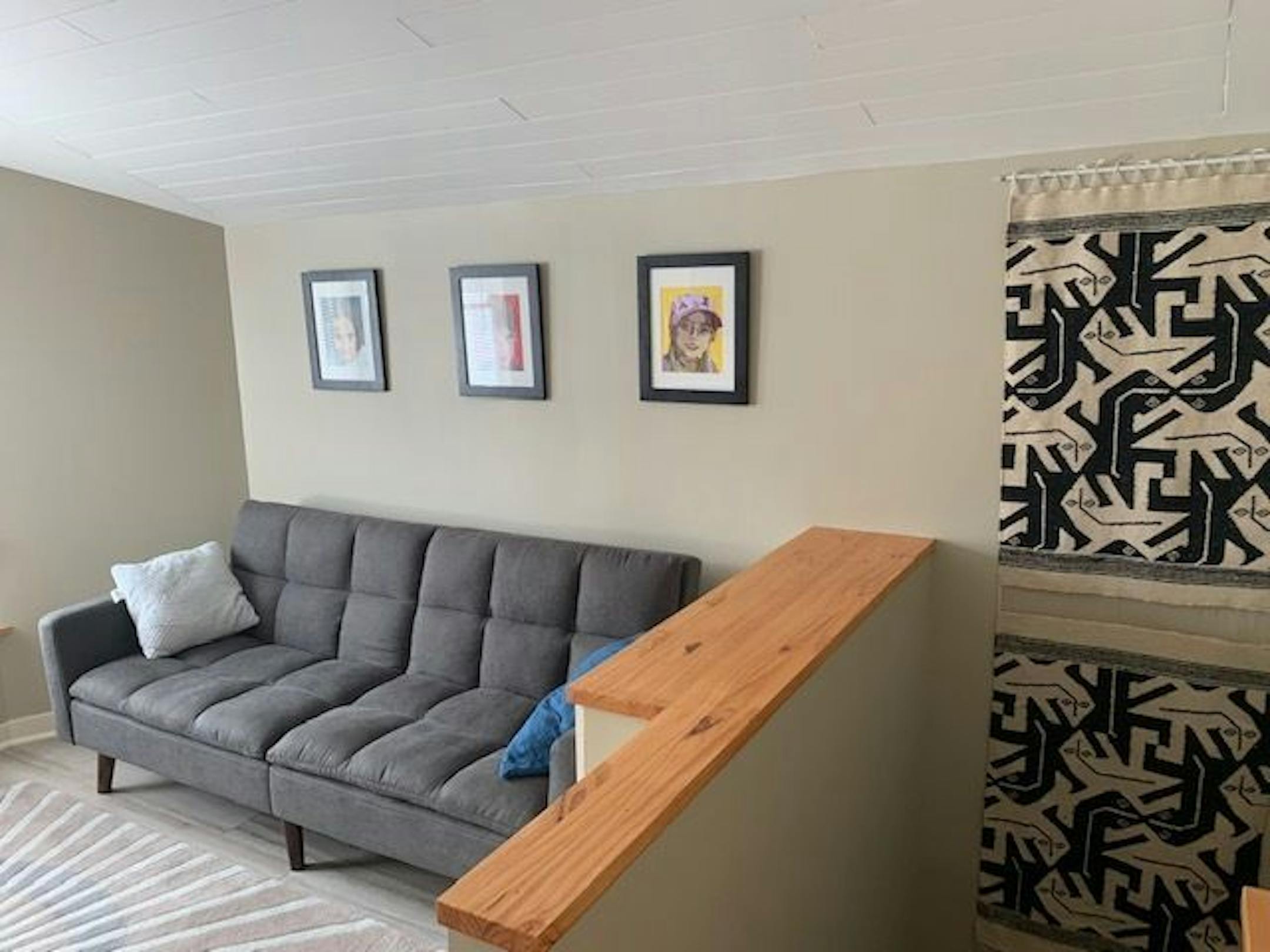 A convertible sofa accommodates sleepovers. It also folds in half length-wise, which is how it was possible to get it up the staircase into the room.
