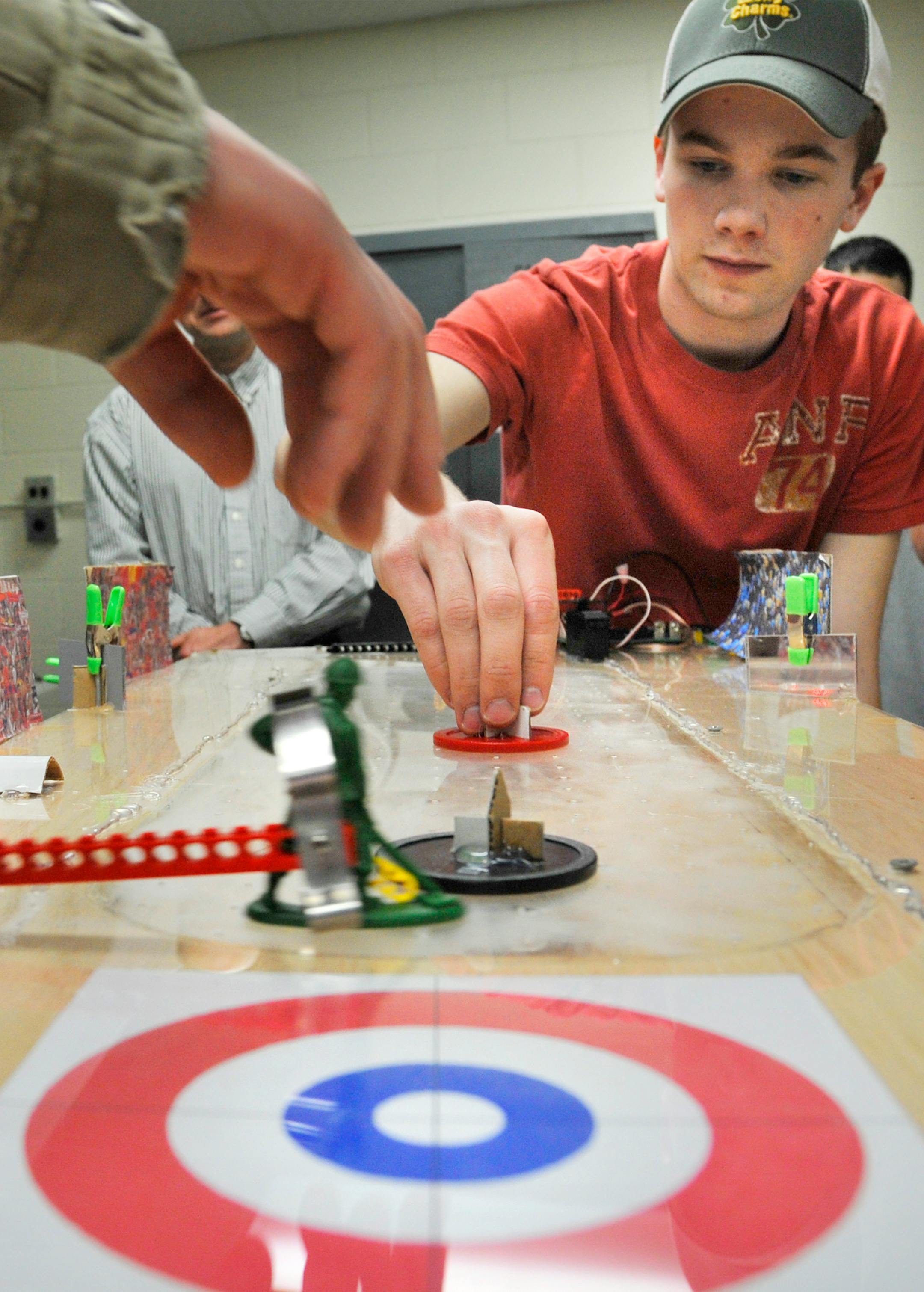 Andrew Kotz demonstrated the curling robot he and his classmates designed at the fab lab in White Bear Lake. The idea is to teach students to use state-of-the-art manufacturing technology in real life. Students have built robots, a windmill and an electric car. The labs started seven years ago with a National Science Foundation grant.