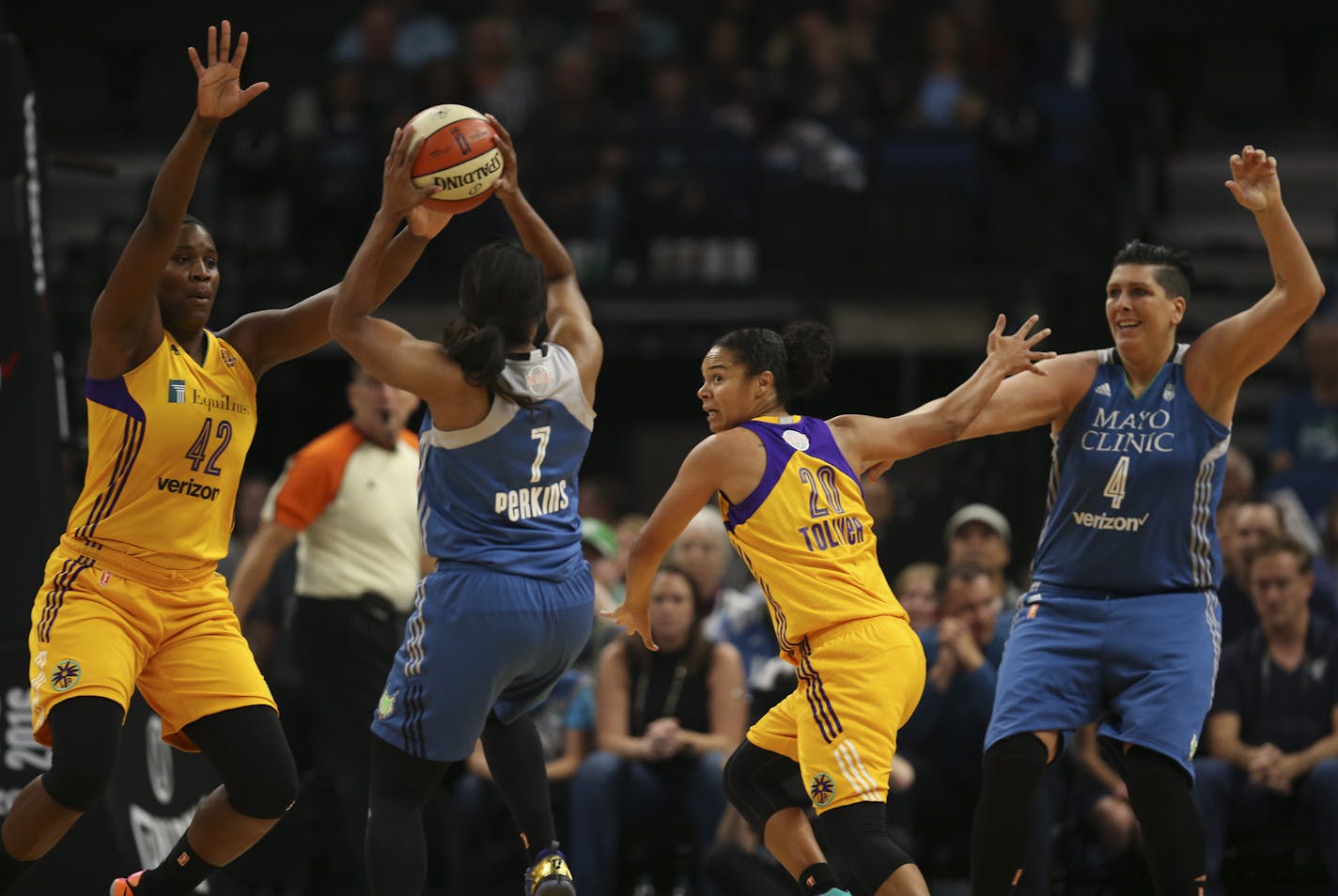 Minnesota Lynx center Janel McCarville (4) tried to get open for a pass from guard Jia Perkins (7) in the first quarter. Los Angeles Sparks center Jantel Lavender (42) and guard Kristi Toliver (20) defended. ] JEFF WHEELER &#xef; jeff.wheeler@startribune.com The Minnesota Lynx faced the Los Angeles Sparks in Game 2 of their WNBA Championship series Tuesday night, October 11, 2016 at Target Center in Minneapolis.