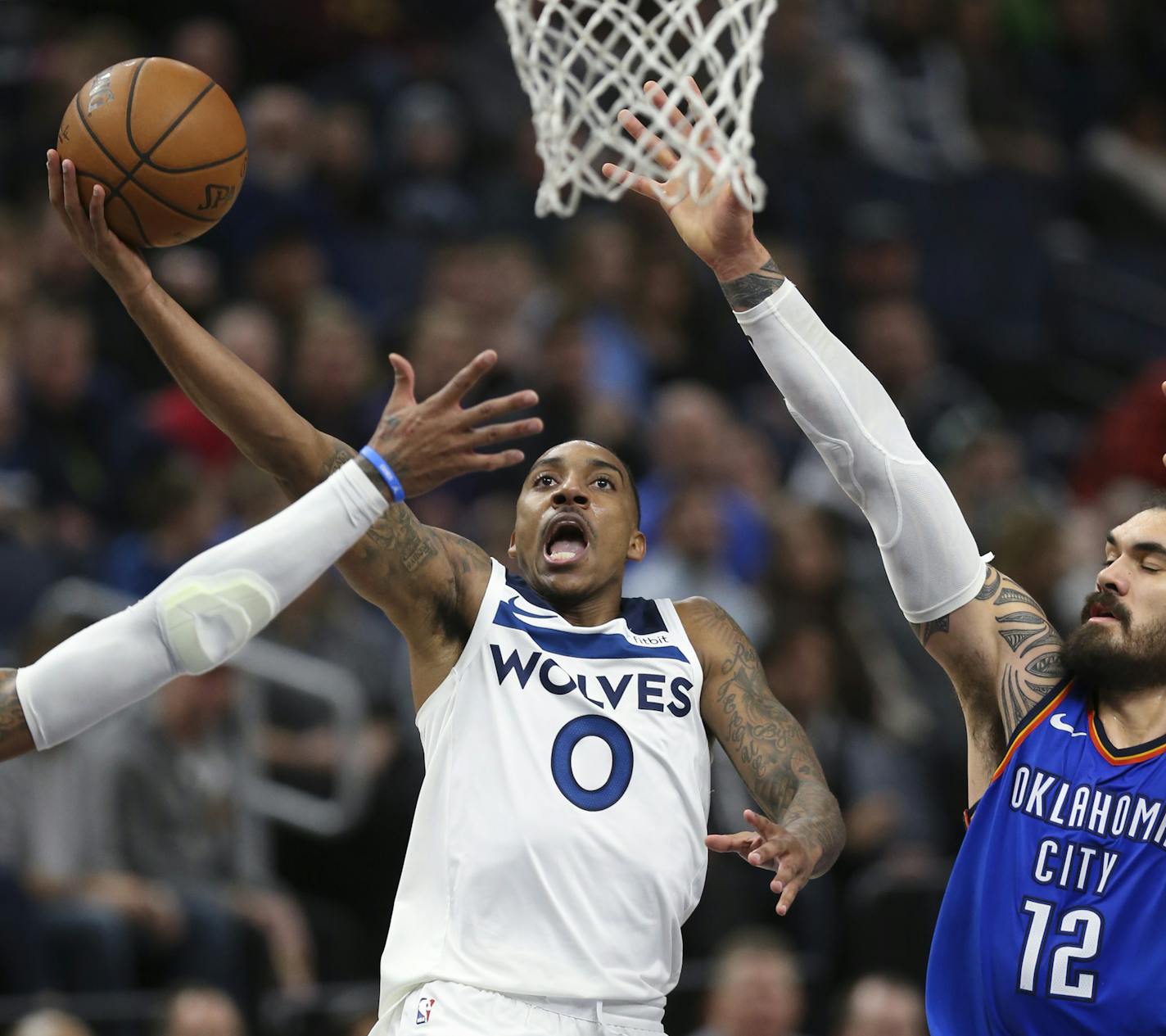 The Minnesota Timberwolves' Jeff Teague (0) puts up a shot in the third quarter as he's defended by the Oklahoma City Thunder's Steven Adams (12) on Wednesday, Jan. 10, 2018, at Target Center in Minneapolis. The Timberwolves won, 104-88. (Jeff Wheeler/Minneapolis Star Tribune/TNS)