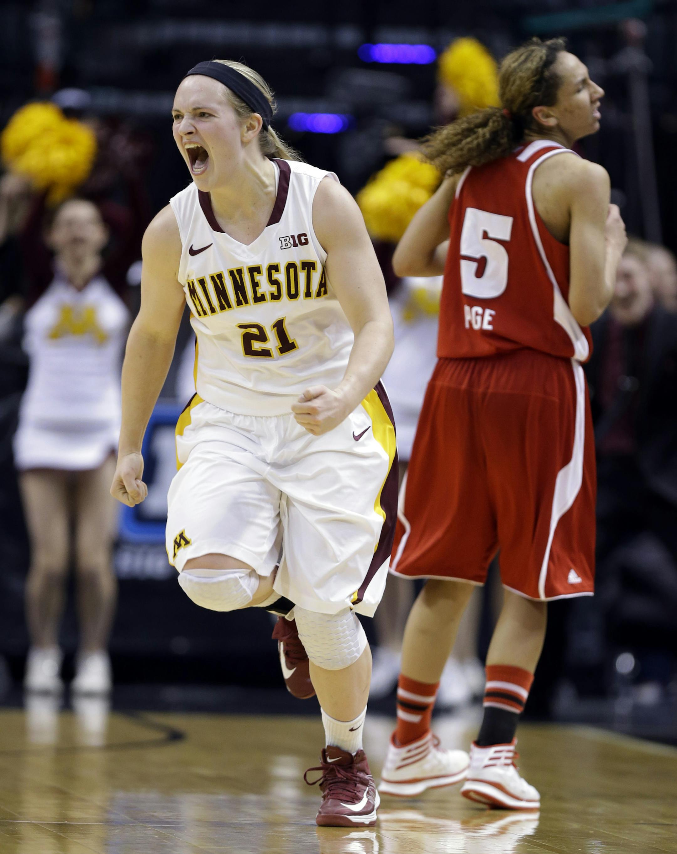 Minnesota guard Sari Noga celebrates after hitting a 3-point basket during overtime against Wisconsin in the second half of an NCAA college basketball game in the opening round of the Big Ten Tournament in Indianapolis, Ind., Thursday, March 6, 2014. Minnesota defeated Wisconsin 74-68. (AP Photo/Michael Conroy)