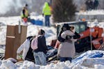 The Minnesota Department of Transportation clears and vacates the homeless encampment at E. Lake St and Hiawatha Avenue in Minneapolis on Feb. 7, 2023