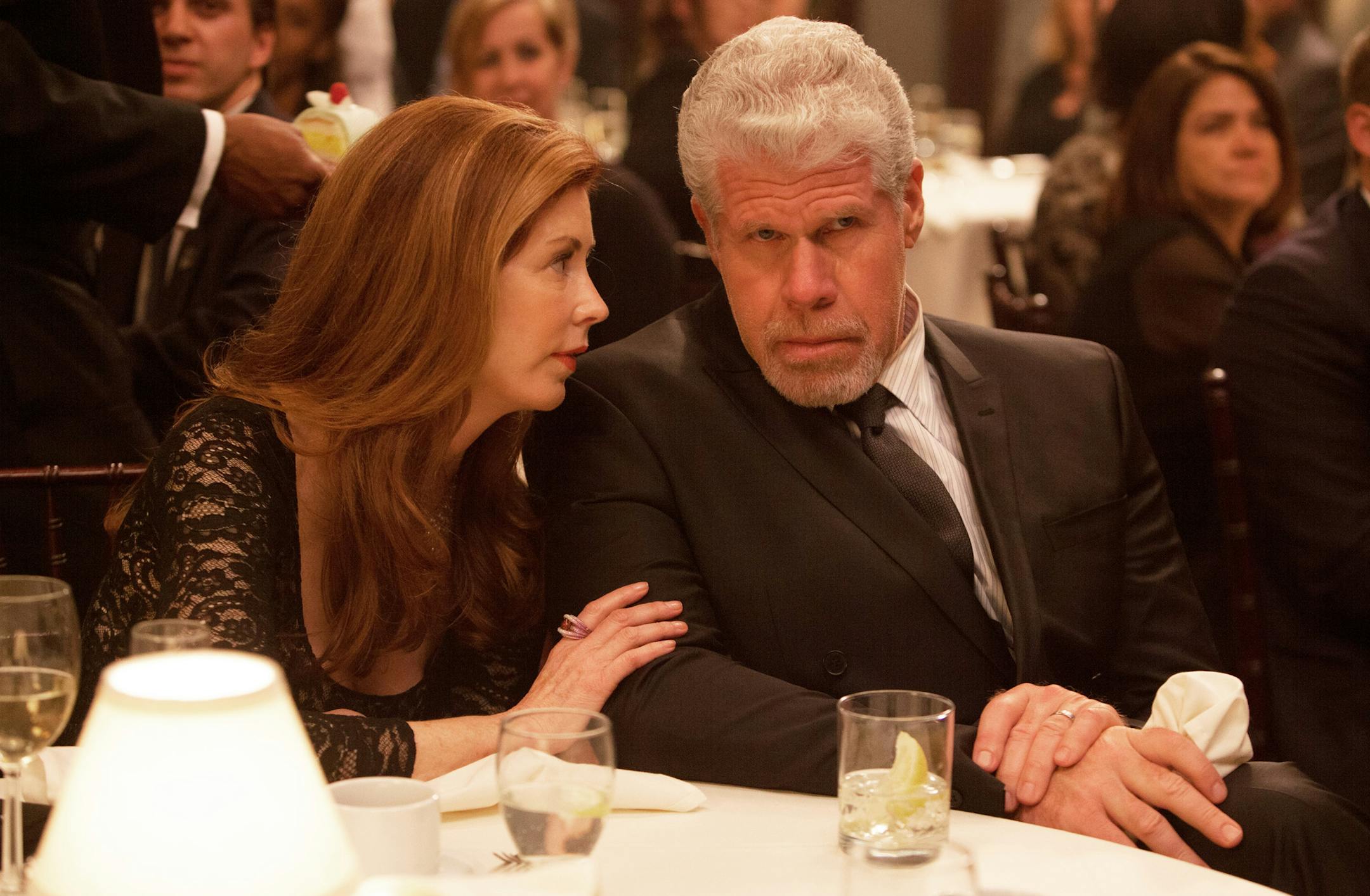 This image provided by Amazon Studios shows Dana Delany, left, and Ron Perlman in a sceen from "Hand of God." The gutsy drama, which centers on "Sons of Anarchy" and "Hellboy" star Ron Perlman as a judge who believes God is guiding him after his family is attacked, is among the latest batch of potential series that'll be streamed online beginning Aug. 28 by Amazon. (AP Photo/Amazon Studios, Karen Ballard)