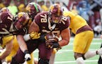 Daniel Faalele, 6-9 and 400 pounds, broke a handful of tackles to score on a 6-yard run for the Maroon team on Saturday. "He just kept moving his feet