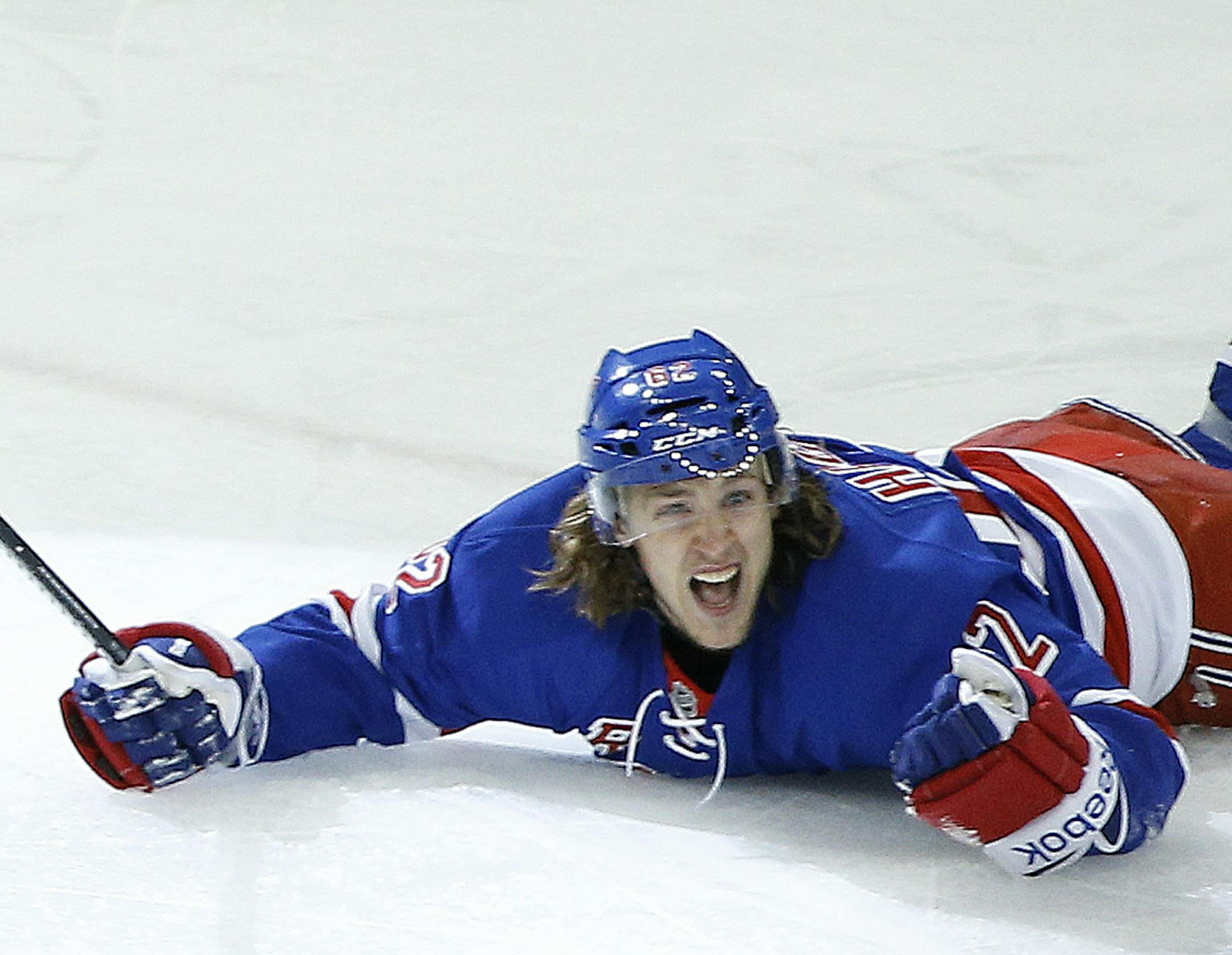 New York Rangers left wing Carl Hagelin (62) reacts after scoring the winning goal in overtime of Game 5 against the Pittsburgh Penguins in the first round of the NHL hockey Stanley Cup playoffs, Friday, April 24, 2015, in New York. The Rangers won 2-1 to take the series and advance to the second round.(AP Photo/Julie Jacobson)