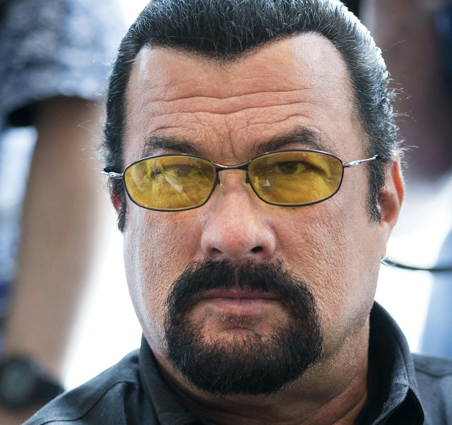 FILE - This June 2, 2013, file photo shows actor Steven Seagal looking on as he waits for a news conference of U.S. Congressional delegation to Russia in U.S. Embassy in Moscow, Russia. Seagal is accused of rape by two women. He denies the allegations. (AP Photo/Alexander Zemlianichenko, File)