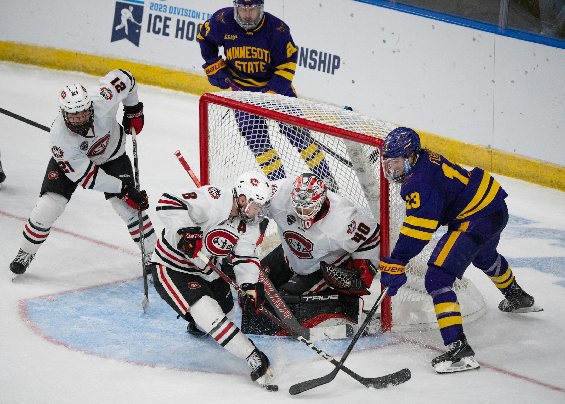 St. Cloud State Huskies forward Aidan Spellacy (8) blocked a shot by Minnesota State Mavericks defenseman Jake Livingstone (23) in front of Huskies goaltender Jaxon Castor (40) in the third period.