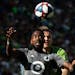Minnesota United defender Romain Metanire (19) and Seattle Sounders forward Jordan Morris (13) compete for a header during the final game of the regul