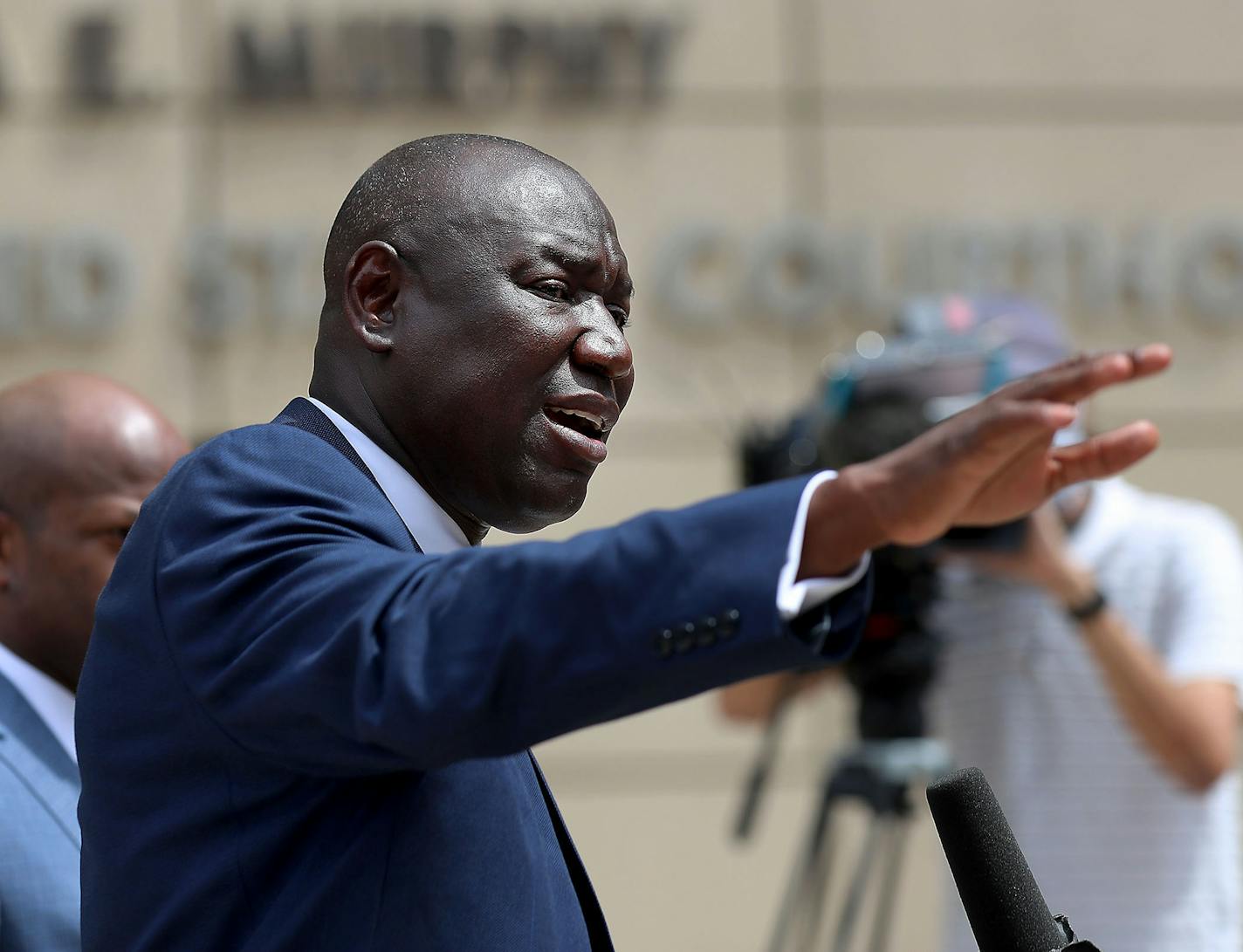 Attorney Ben Crump, who represents George Floyd's family, announced in a press conference that the family of Floyd is suing the city of Minneapolis and the four officers involved in his death, citing a failure in proper police training and a racist departmental culture that led to a "reckless disregard" of Floyd's civil rights Wednesday outside the US Federal Courthouse in Minneapolis. Here, Crump at the podium with members of his legal team.] DAVID JOLES • david.joles@startribune.com Attorney B