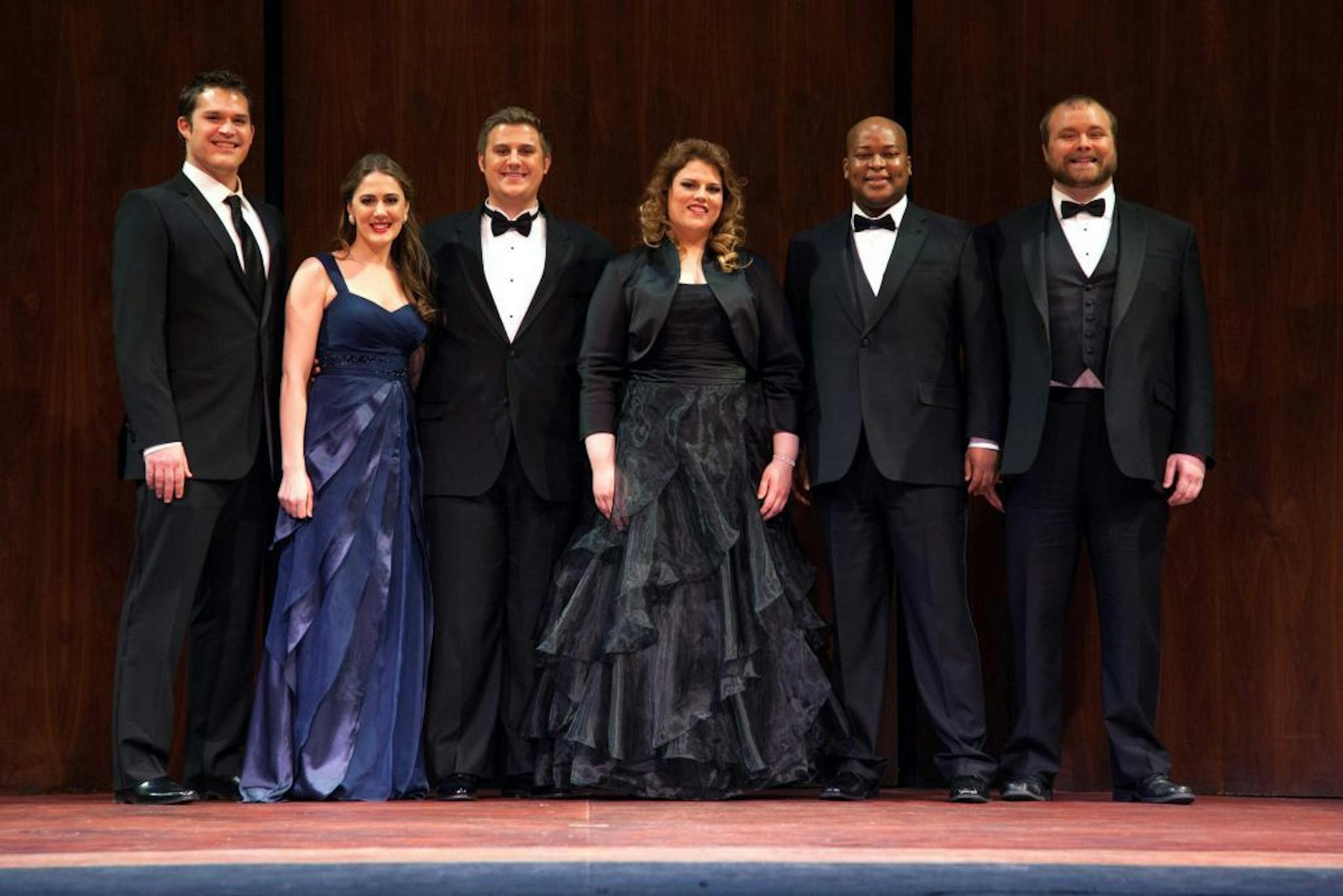 This March 10, 2013 photo provided by the Metropolitan Opera shows the winners of the Metropolitan Opera National Council Grand Finals Concert in New York. The winners, from left, Brandon Cedel, Sydney Mancasola, Michael Brandenburg, Rebecca Pedersen, Musa Ngqungwana and Thomas Richards, will each receive a $15,000 grant for further study.