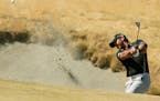 Jason Day hit out of a bunker during last year's U.S. Open. Day, the No. 1 ranked player in the world, hasn't had an easy road to the top.