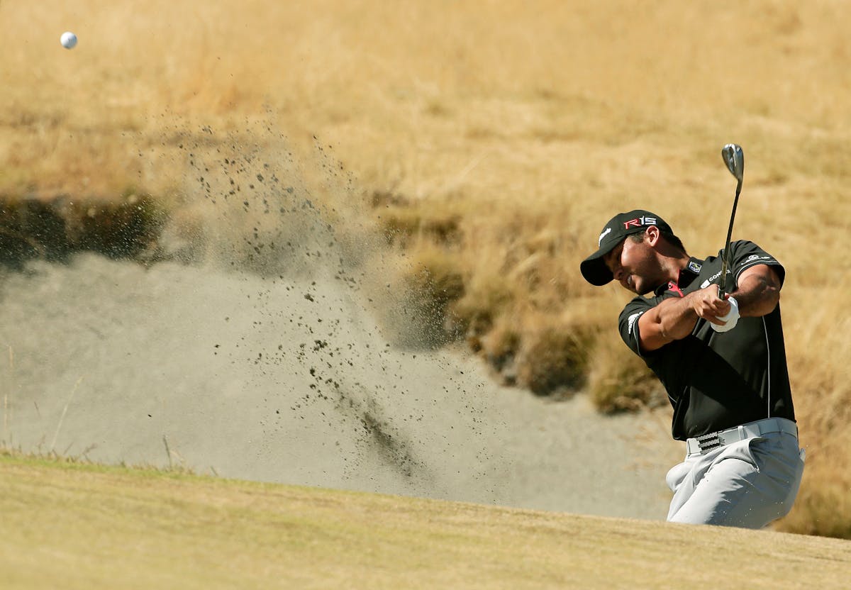 Jason Day hit out of a bunker during last year's U.S. Open. Day, the No. 1 ranked player in the world, hasn't had an easy road to the top.