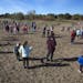 Students at Otter Lake Elementary school in White Bear Lake planted seeds for a new 2.3 acre prairie behind the school Wednesday afternoon. ] Brian.Pe