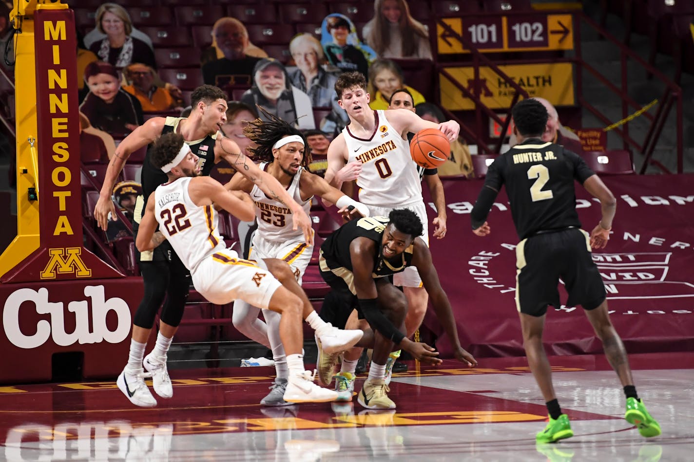 Minnesota Gophers guard Gabe Kalscheur (22), forward Brandon Johnson (23) and center Liam Robbins (0) battled for a defensive rebound against Purdue Boilermakers forward Mason Gillis (0) and forward Trevion Williams (50) in the first half. ] AARON LAVINSKY • aaron.lavinsky@startribune.com