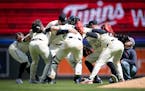 The Twins formed a victory huddle after extending their winning streak to four games against the White Sox on April 25.