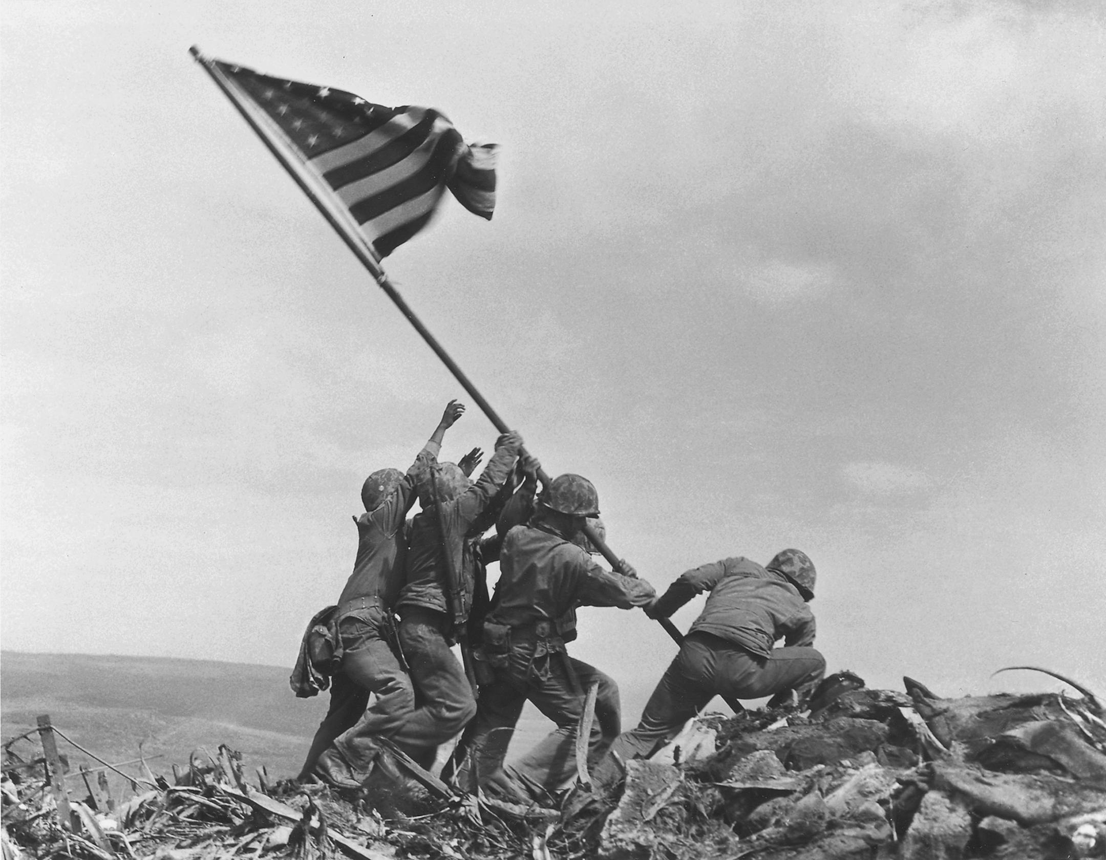 FILE - U.S. Marines of the 28th Regiment, 5th Division, raise the American flag atop Mt. Suribachi, Iwo Jima, on Feb. 23, 1945 during World War II.
