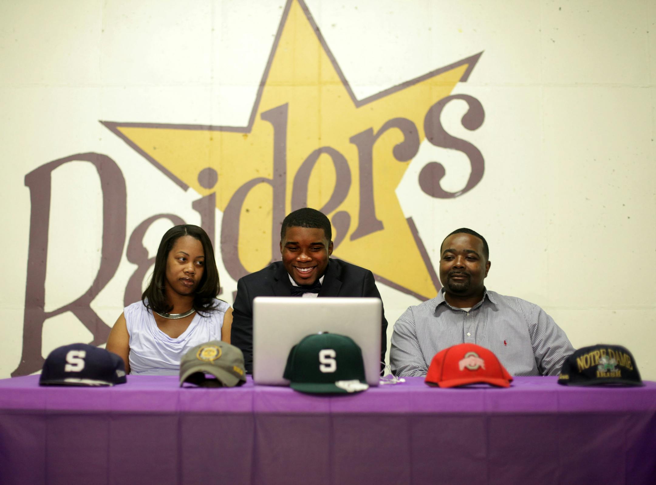 Jashon Cornell sat between his parents Sheena Cornell and Keeshon Parker, before he announced his decision to attend Ohio State as a defensive end at Cretin-Derham Hall on Wednesday morning. The other schools in the running were Michigan State, Notre Dame, Iowa and Penn State.