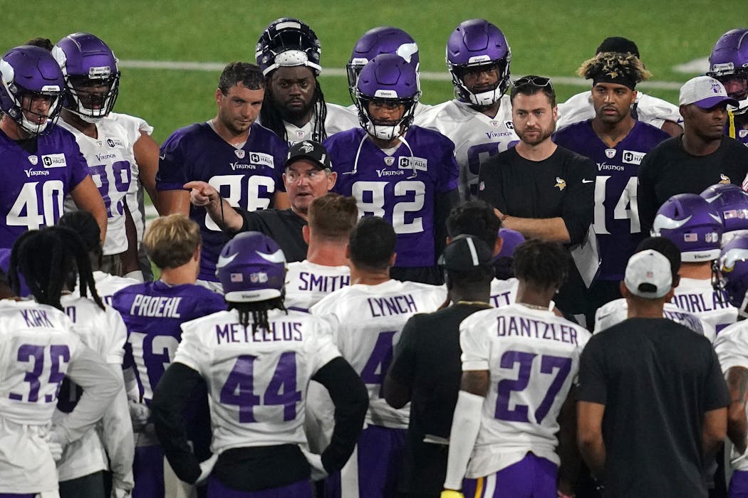 Mike Zimmer leads a practice during training camp. 