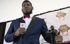 FILE - In this Dec. 7, 2017, file photo, Houston defensive tackle Ed Oliver, winner of the Outland Trophy for outstanding interior lineman, stands wit
