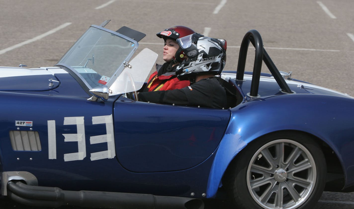 Nikki Dahlman coaches Doug Sisk at a Minnesota Autocross School event at Midway Stadium in St. Paul April 27.