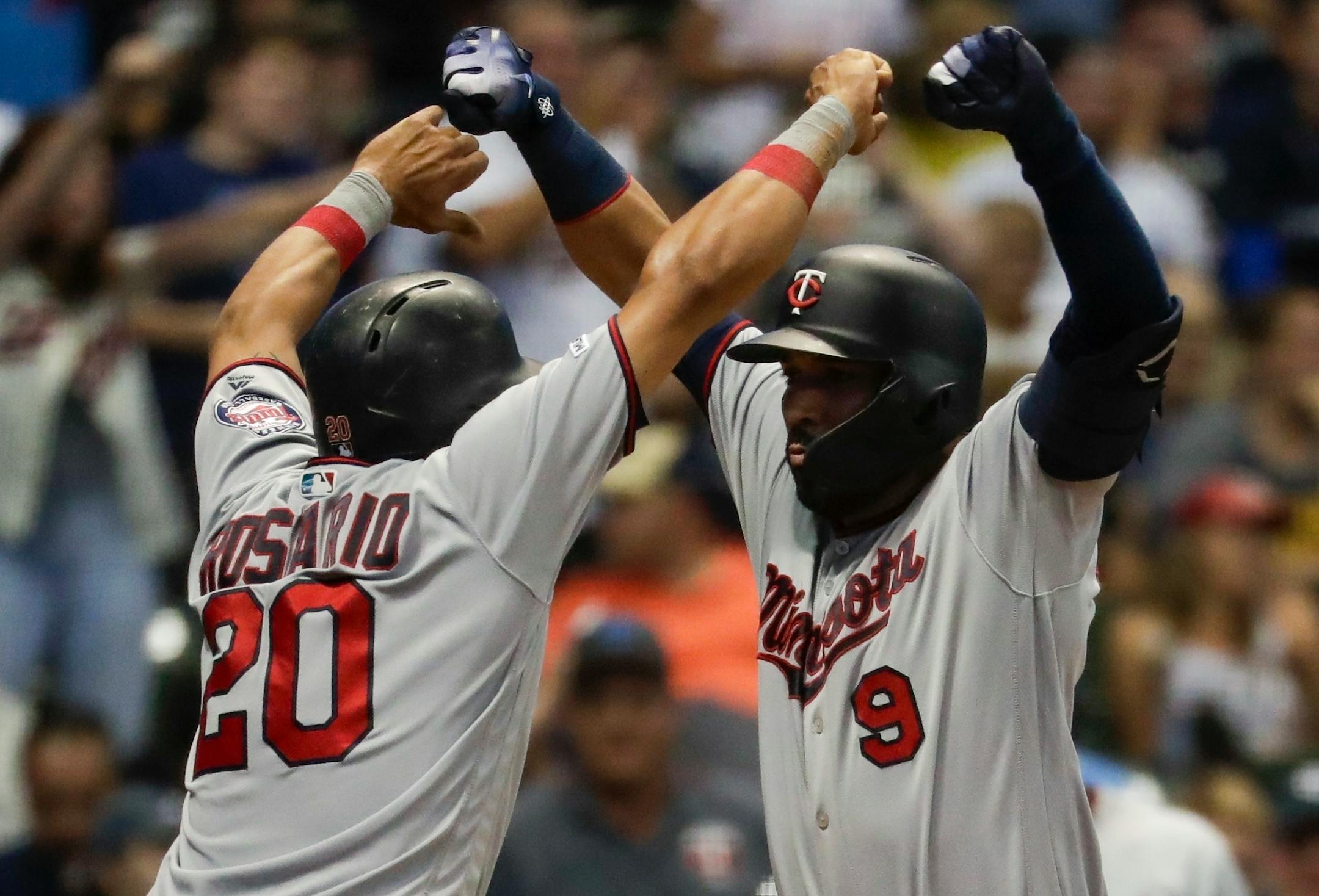 The Twins' Marwin Gonzalez, right, celebrated with Eddie Rosario after hitting a three-run home run in the eighth inning of a 7-5 victory over the Brewers on Tuesday.