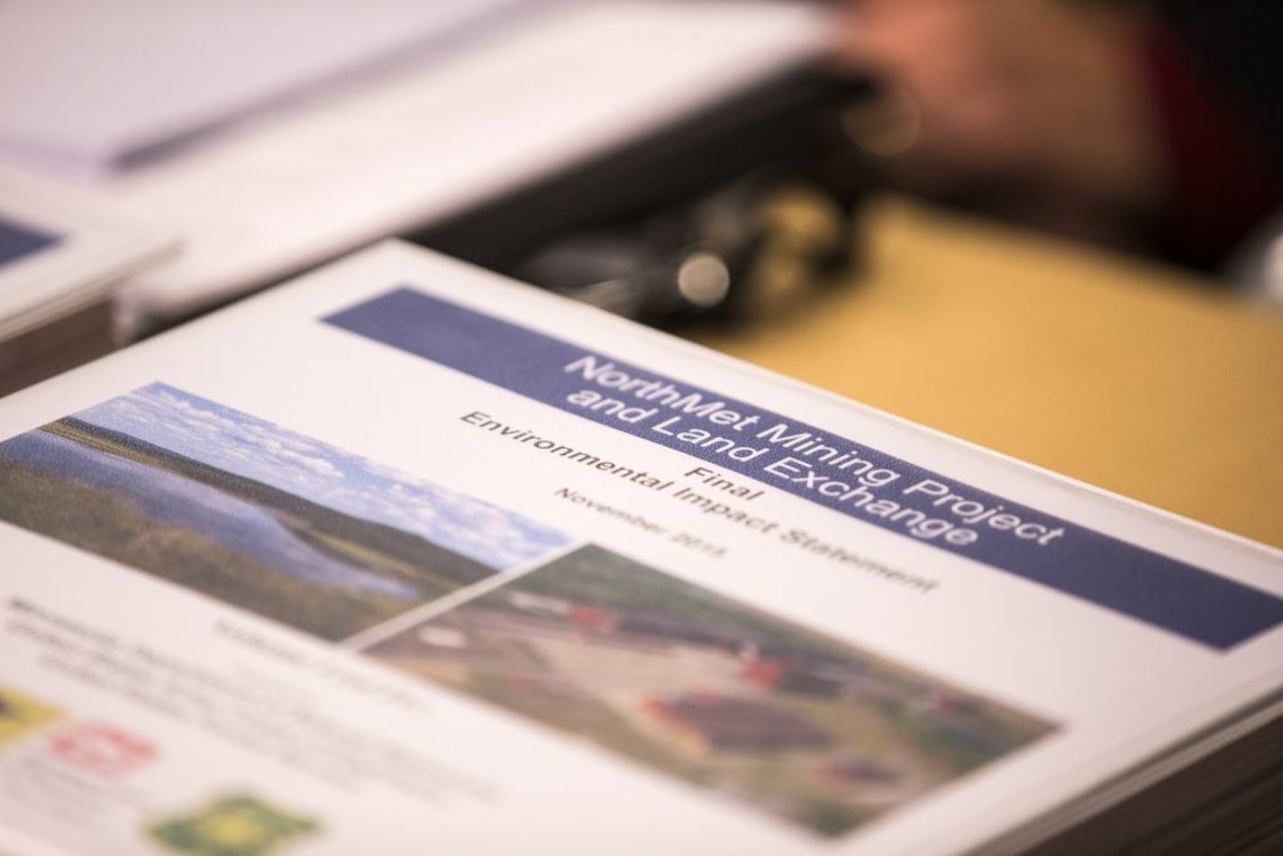 The final environmental impact statement for the NorthMet mining project is displayed during a news conference at the Minnesota Department of Natural Resources central office in St. Paul on Friday.