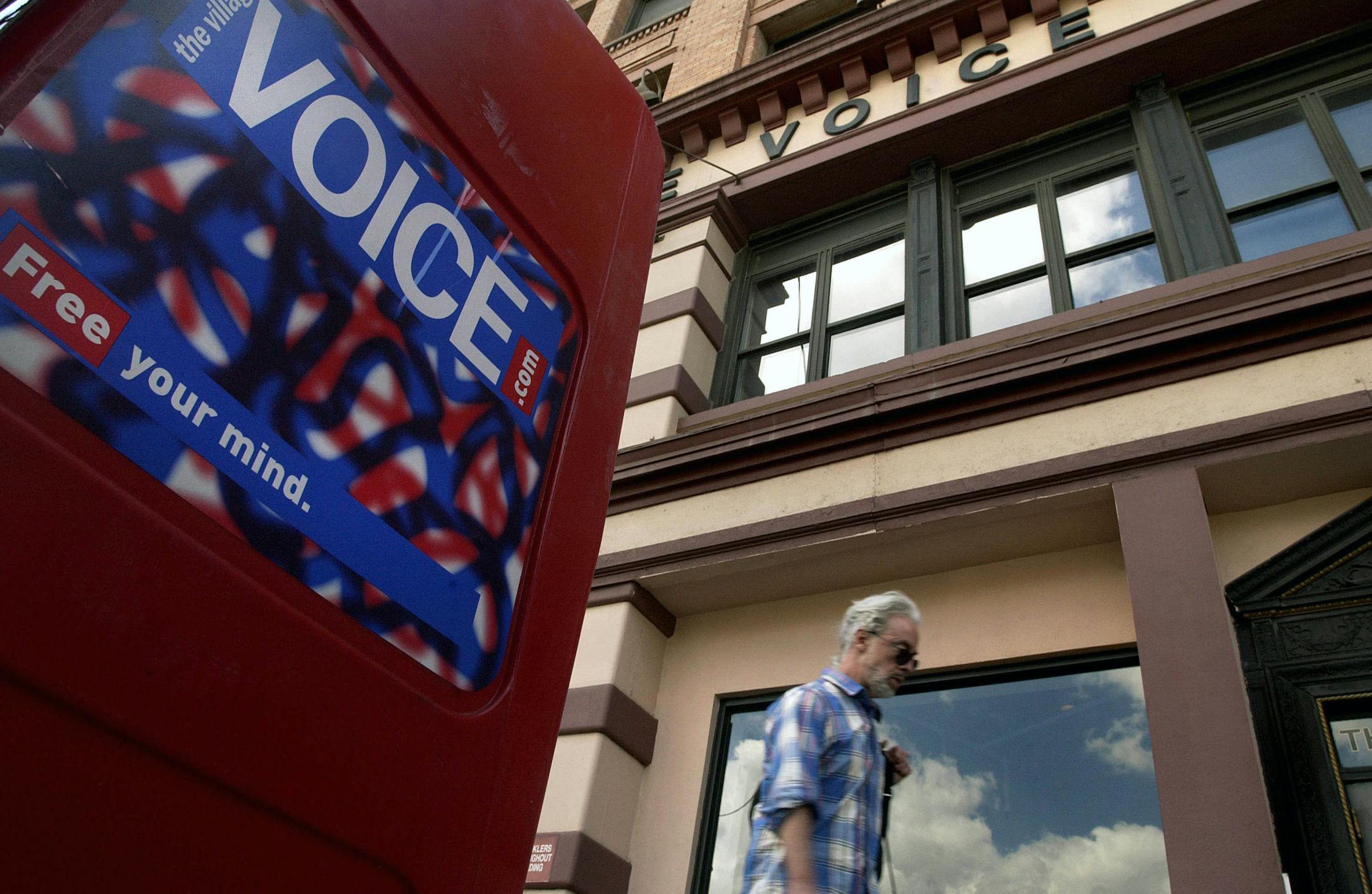 A man walks past the offices of the Village Voice in New York. The Village Voice is ending its free weekly print edition, the company announced on Tuesday. (Scott Eells/The New York Times)
