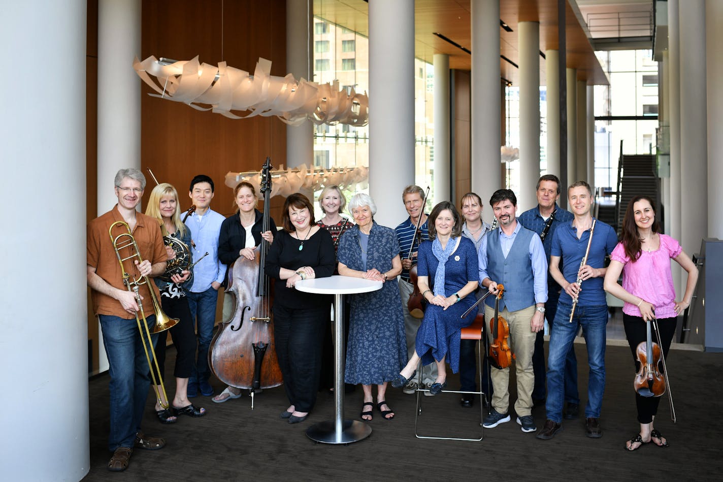 Symphony Ball chairwomen MaryAnn Goldstein, Paula DeCosse and Laurie Greeno, center, posed at Orchestra Hall with a group of the orchestra musicians they championed in the 2012-14 lockout. From left, Doug Wright, Ellen Dinwiddie Smith, Rui Du, Kristen Bruya, Wendy Williams, Richard Marshall, Marni J. Hougham, Michael Sutton, David Pharris, Greg Milliren and Rebecca Corruccini.