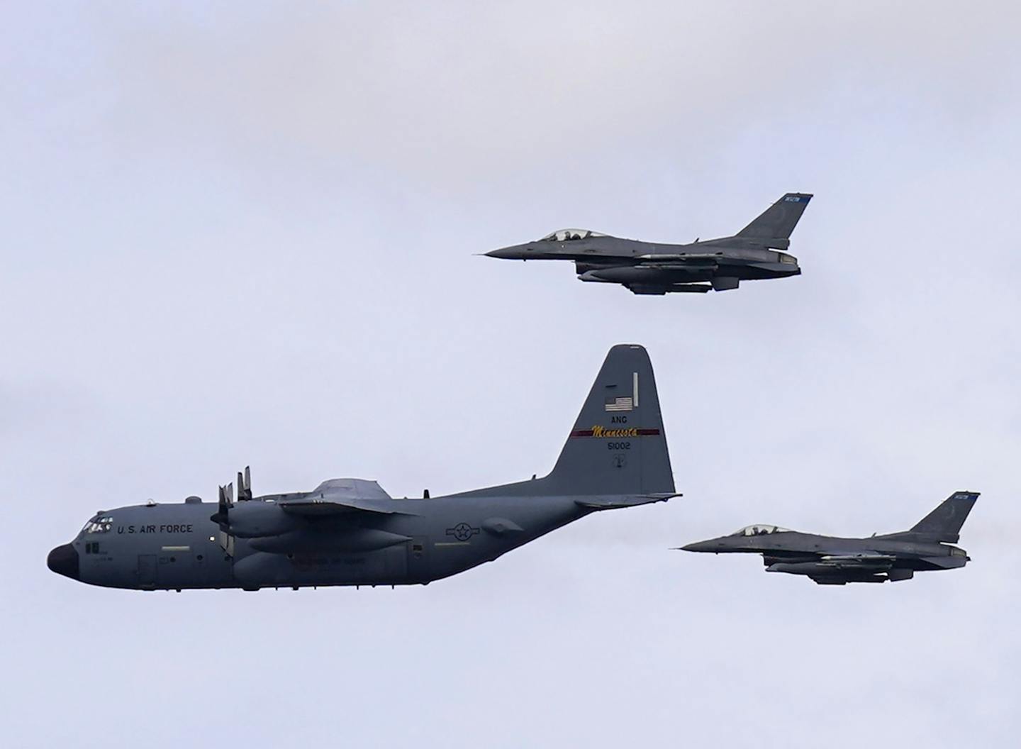 FILE-A pair of F-16 Fighting Falcon aircraft from the 148th Fighter Wing out of Duluth flanked a C-130 Hercules aircraft from the 133rd Air Wing out of Fort Snelling May 6, 2020, to honor frontline health care workers. A military contractor wants to bring a U.S. Air Force F-16 maintenance contract to Duluth. (Jeff Wheeler/Star Tribune via AP)