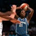 Minnesota Lynx's Nicky Anosike (21) looked to pass away from New York Liberty's Janel McCarville (4) Saturday in New York.