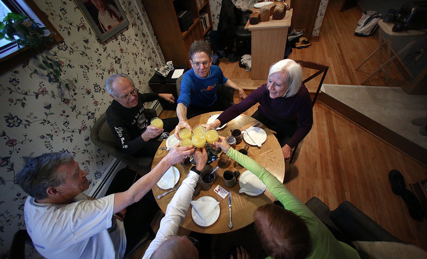 The runners celebrated their tradition with a toast. Runners are (l to r from bottom right): Sheila Cole; Dan Cole; Jim Martin; Jim Patrykus; Jeff Grosscup and Karin Grosscup. ] Photo by Jim Gehrz / JIM GEHRZ&#x2022;jgehrz@startribune.com (JIM GEHRZ/STAR TRIBUNE) / February 9, 2013 / 11:00 AM Minneapolis, MN** BACKGROUND INFORMATION: A group of Minneapolis friends have been running together each Saturday morning for 20 years. After each run, the group ends up at one of their homes, where they en