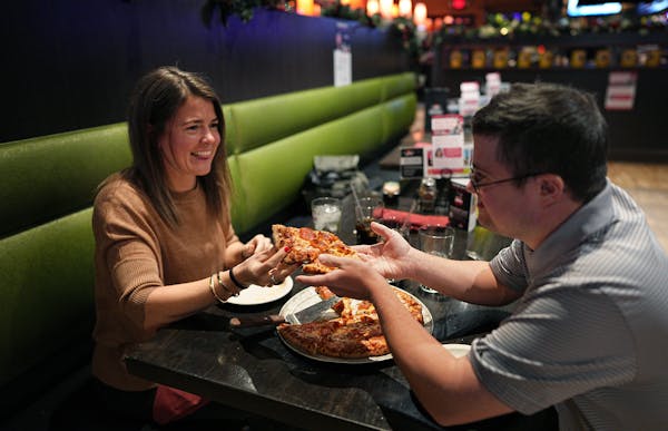 Alison Spencer and her brother Teddy sampled pepperoni pizza at Pizza Luce in Hopkins.