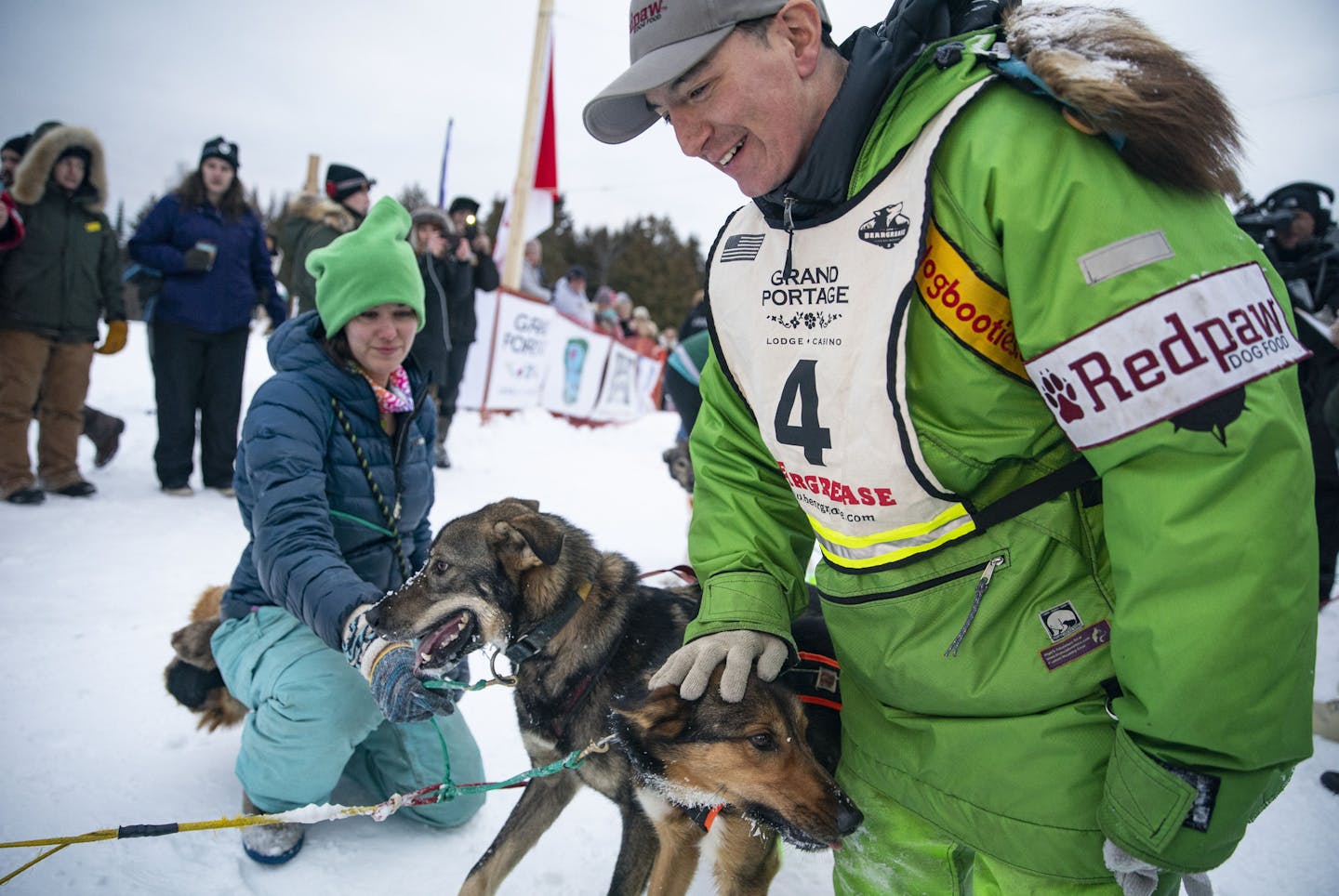 Ryan Redington pet each of his dogs head after winning the John Beargrease sled dog marathon on Tuesday evening. Redington finished the race with a total trail time of 29 hours 8 minutes and 19 seconds, finishing approximately 14 minutes and 56 seconds ahead of Keith Aili.